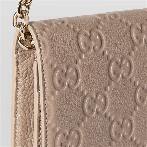 GG Emblem super mini shoulder bag in taupe leather 